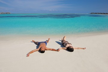 Fototapeta na wymiar happy young couple enjoying summer on beach