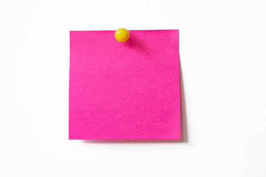 Pink sticky note on white background