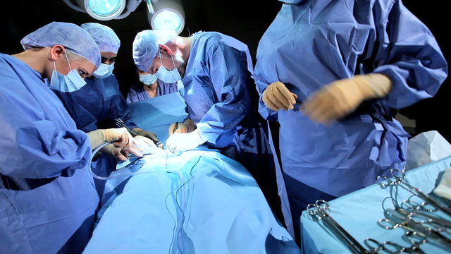 Specialized Team Performing Surgery in Operating Room