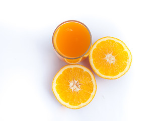 Orange juice and slices of orange isolated on white