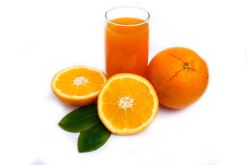 Orange juice and oranges on glass