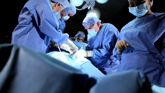 Male Female Doctors Students in Operating Room