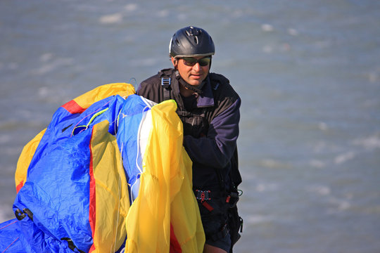 paraglider carrying his wing