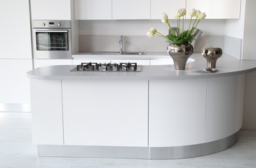 Modern white kitchen with closed oven