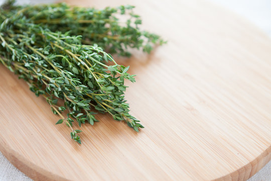 sprigs of thyme on the board