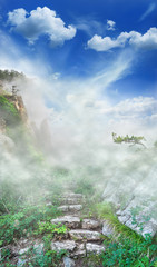 Magic landscape with mountains, sky and ruins