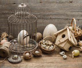 vintage easter decoration with eggs and birdcage