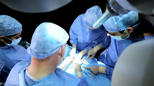 Overhead View Male Female Doctors in Operating Room