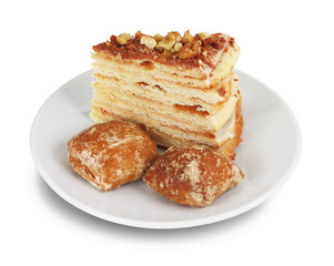 Cake with nuts and chocolate crumbs and two gingerbreads
