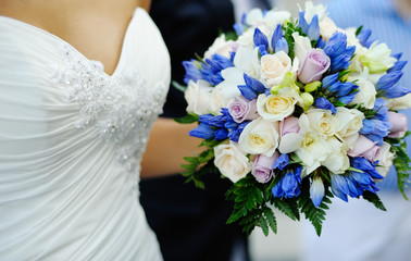 wedding bouquet  in the hands of bride