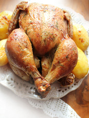 Roasted whole chicken with potatoes