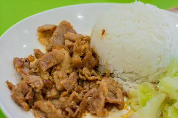 Rice with fried garlic-pepper pork (Thai food)