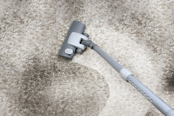 Vacuuming the carpet