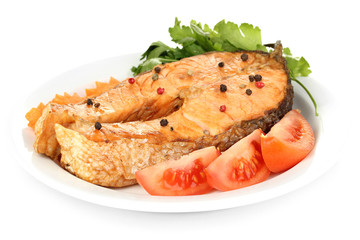 Appetizing grilled salmon with vegetables isolated on white