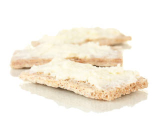 Crispbread with milk cheese, isolated on white