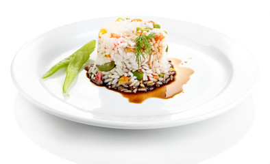 Delicious risotto with vegetables, isolated on white