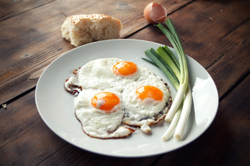 Breakfast with fried eggs and spring onion