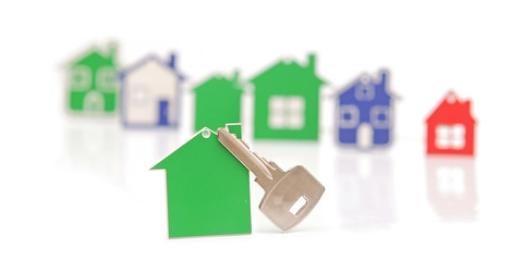silver key with blank label shaped home. space for your text