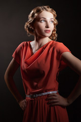 Fototapeta premium Portrait of a beautiful female model on dark background