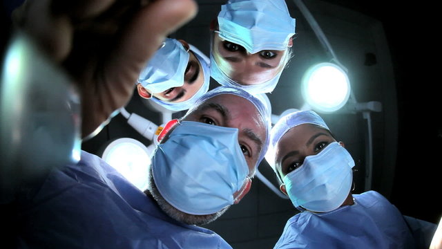 Doctors in Hospital Operating Room Faces Hands