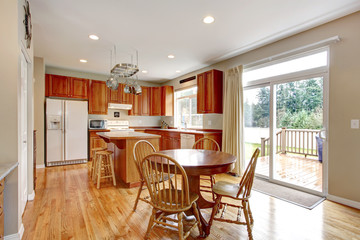 Classic large wood kitchen interior with hardwood floor.