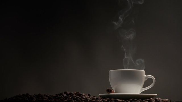 Cup of coffee on dark background