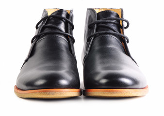 Pair of modern black leather shoes with laces isolated