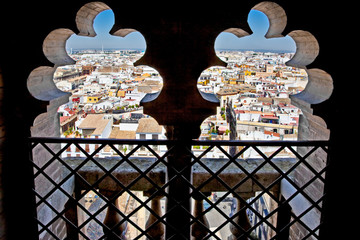 Fototapeta na wymiar Panoramic view on Seville through windows of Saint Mary cathedra