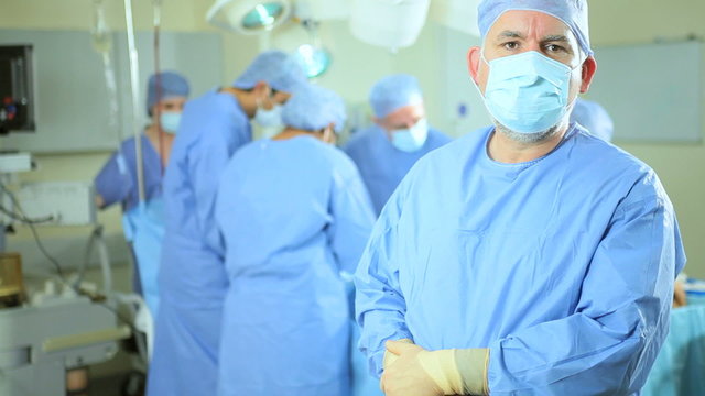 Doctor Portrait with Surgical Team Background