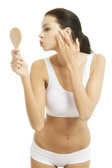 Attractive woman with handy mirror