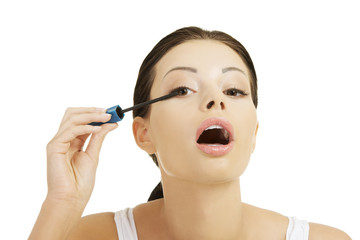 Woman face with mascara brush