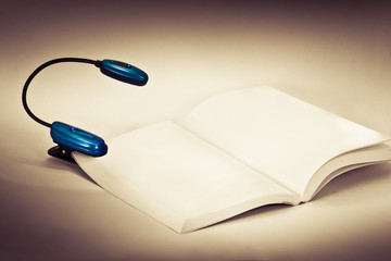 Reading light on blank pages of a book