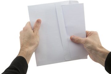 man's hands holding envelope with paper