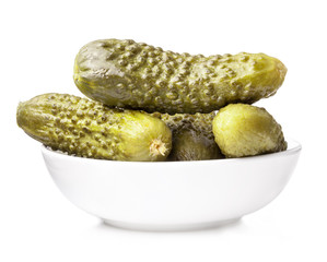 Pickles (gherkins) in small bowl isolated on white background