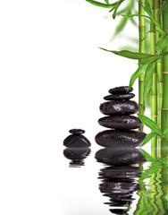 Spa still life with lava stones and bamboo sprouts  - obrazy, fototapety, plakaty