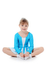 Little girl the gymnast does exercise