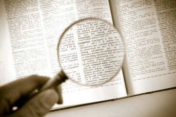 A magnifying glass on the word computer - 50499579