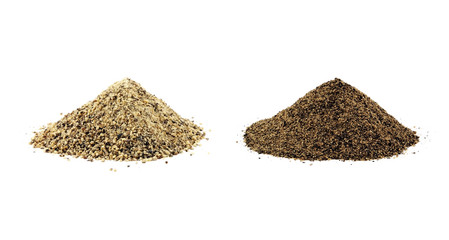 Ground white pepper and black pepper isolated