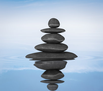 Zen stones balance in water concept 