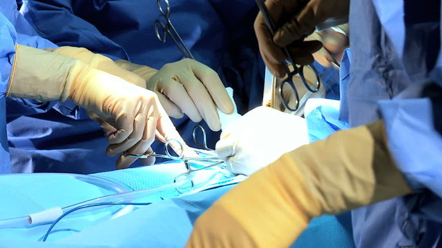 Close Up Hands Surgical Team Operating Theater