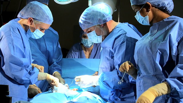 Surgical Team Working Hospital Operating Room