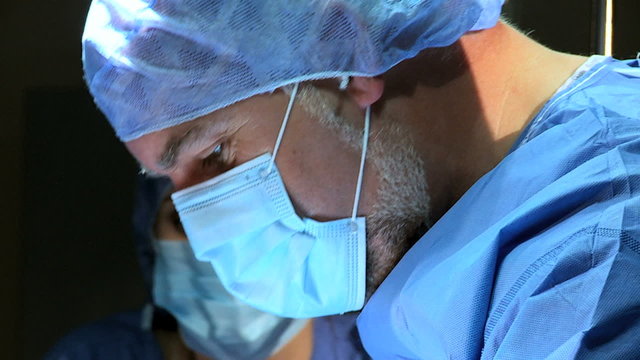Close Up Male Surgeon Operating Room