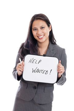 Asian businesswoman with help wanted sign