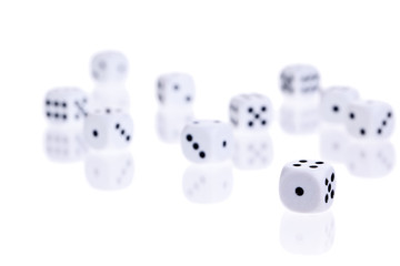 Scattered dice isolated on white