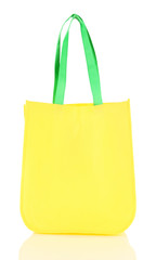 Yellow bag with green handles isolated on whit