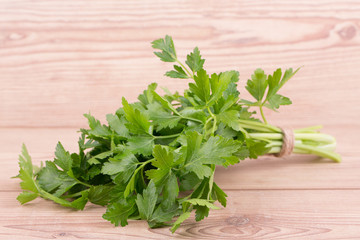 Raw vegetables with parsley on wooden background