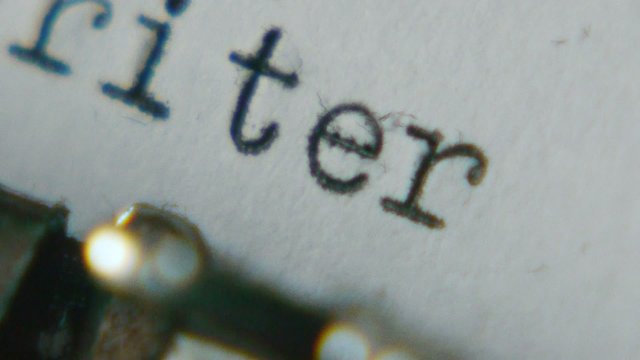 Typing "screenwriter" on an old typewriter