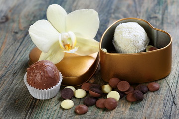 Fototapeta na wymiar White Orchid and handmade chocolates.