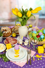 Serving Easter table on room background