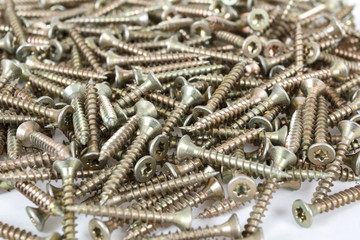 Closeup pile of screw on white